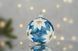 Christmas tree ball "White magnolia on blue"