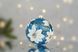 Christmas tree ball "White magnolia on blue"